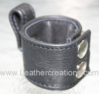 Garment leather ball stretcher which attaches to a cock ring